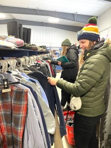 Happy people thrift shopping clothing